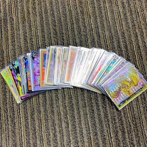 Bulk lot Pokémon cards in protective sleeves.  88 cards total.